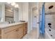 Elegant bathroom with granite countertop and tiled shower at 3449 N Canoe Creek Rd, Kenansville, FL 34739