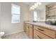 Modern bathroom with granite vanity and tiled flooring at 3449 N Canoe Creek Rd, Kenansville, FL 34739