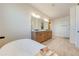 Spa-like bathroom featuring a freestanding tub and double vanity at 3449 N Canoe Creek Rd, Kenansville, FL 34739