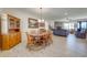 Quaint dining room with wooden table and chairs, plus a hutch at 3449 N Canoe Creek Rd, Kenansville, FL 34739