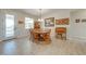 Charming dining area with a rustic wooden table and chairs at 3449 N Canoe Creek Rd, Kenansville, FL 34739