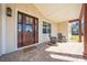 Inviting front porch with rocking chairs and a brick patio at 3449 N Canoe Creek Rd, Kenansville, FL 34739