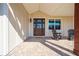 Inviting front porch with rocking chairs and a brick patio at 3449 N Canoe Creek Rd, Kenansville, FL 34739