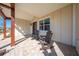Inviting front porch with rocking chairs and a brick patio at 3449 N Canoe Creek Rd, Kenansville, FL 34739