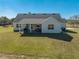 Single story home with covered patio and large backyard at 3449 N Canoe Creek Rd, Kenansville, FL 34739