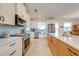 Modern kitchen featuring stainless steel appliances and light-colored cabinetry at 3449 N Canoe Creek Rd, Kenansville, FL 34739