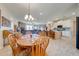 Open concept kitchen with island, stainless steel appliances, and light tile floors at 3449 N Canoe Creek Rd, Kenansville, FL 34739