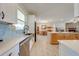 Kitchen boasts ample counter space, stainless steel appliances, and a farmhouse sink at 3449 N Canoe Creek Rd, Kenansville, FL 34739