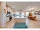 Open concept kitchen with island and seating, stainless steel appliances, and light colored cabinets at 3449 N Canoe Creek Rd, Kenansville, FL 34739