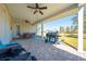 Relaxing covered patio with outdoor dining and grill at 3449 N Canoe Creek Rd, Kenansville, FL 34739