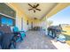 Covered patio with paver stones, outdoor seating and grill at 3449 N Canoe Creek Rd, Kenansville, FL 34739