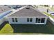 Rear exterior view highlighting a screened lanai and a fenced backyard for privacy at 401 Chayne Pl, St Cloud, FL 34771