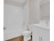 A well-lit bathroom features a white shower, toilet, and vanity at 401 Chayne Pl, St Cloud, FL 34771