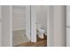 Bathroom with white toilet and view into the walk in closet at 401 Chayne Pl, St Cloud, FL 34771