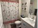 Charming bathroom with butterfly shower curtain, stylish decor, and a modern sink at 401 Chayne Pl, St Cloud, FL 34771