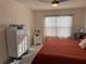 Bright bedroom with large window and comfortable bed and dressers at 401 Chayne Pl, St Cloud, FL 34771