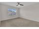 Bright bedroom with neutral carpet and a ceiling fan at 401 Chayne Pl, St Cloud, FL 34771