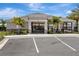 Attractive community clubhouse with a covered area, landscaping and ample parking spaces at 401 Chayne Pl, St Cloud, FL 34771