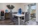 Dining room features modern decor, a stylish table set and access to the patio at 401 Chayne Pl, St Cloud, FL 34771