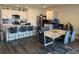 Open kitchen and dining area with bar seating and hardwood style flooring throughout at 401 Chayne Pl, St Cloud, FL 34771