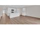 Open concept kitchen with white cabinetry, a central island and stainless steel appliances, creating a modern feel at 401 Chayne Pl, St Cloud, FL 34771