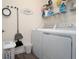 Functional laundry room with modern washer and dryer, providing convenience at 401 Chayne Pl, St Cloud, FL 34771