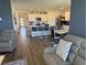 Spacious living room flows into the kitchen with modern countertops and stainless steel appliances at 401 Chayne Pl, St Cloud, FL 34771