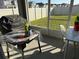 Enclosed patio features a table and chairs, providing a relaxing outdoor space at 401 Chayne Pl, St Cloud, FL 34771