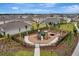 A new neighborhood playground and park in a fenced area with mature trees and landscaping at 401 Chayne Pl, St Cloud, FL 34771