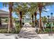 Community pool area entrance with tropical landscaping and pool views at 401 Chayne Pl, St Cloud, FL 34771