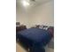 Main bedroom featuring dark wooden furniture and modern decor at 4033 Sunrise Ridge Blvd, Groveland, FL 34736