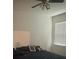 Bedroom featuring natural lighting with an unmade bed and dark comforter at 4033 Sunrise Ridge Blvd, Groveland, FL 34736