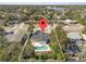 Aerial view of home with backyard pool and mature trees, property outline at 45 S Edgemon Ave, Winter Springs, FL 32708
