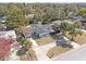 An aerial view of a single-story home, showcasing its simple design and peaceful, tree-lined surroundings at 45 S Edgemon Ave, Winter Springs, FL 32708
