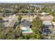 Aerial view of home with backyard pool surrounded by mature trees at 45 S Edgemon Ave, Winter Springs, FL 32708