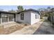 The rear exterior view shows the home's clean lines and access to the outdoor areas, including a glimpse of the backyard at 45 S Edgemon Ave, Winter Springs, FL 32708