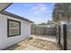 A fenced backyard features minimalist landscaping, providing a serene outdoor space alongside the home's exterior at 45 S Edgemon Ave, Winter Springs, FL 32708