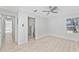 Bedroom with ceiling fan, light wood floors, and an en suite bathroom with a walk-in shower at 45 S Edgemon Ave, Winter Springs, FL 32708