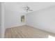 Spacious, bright bedroom has wood-look floors and a ceiling fan at 45 S Edgemon Ave, Winter Springs, FL 32708