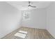 Bedroom features light-colored floors, a ceiling fan, and a bright window at 45 S Edgemon Ave, Winter Springs, FL 32708