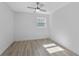 Bright bedroom featuring light-colored floors, a ceiling fan, and a window at 45 S Edgemon Ave, Winter Springs, FL 32708