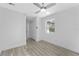Bright bedroom features wood-look floors, a ceiling fan, a closet, and a window at 45 S Edgemon Ave, Winter Springs, FL 32708