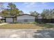 A bright, single-story home boasts clean lines and simple landscaping, creating a welcoming curb appeal at 45 S Edgemon Ave, Winter Springs, FL 32708