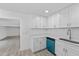 Bright kitchen featuring white cabinets, stainless steel appliances, and stone countertops at 45 S Edgemon Ave, Winter Springs, FL 32708
