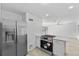 Kitchen featuring white cabinets, stainless steel appliances, and stone countertops at 45 S Edgemon Ave, Winter Springs, FL 32708