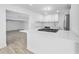Bright kitchen featuring white cabinets, stainless steel appliances, and stone countertops at 45 S Edgemon Ave, Winter Springs, FL 32708