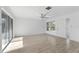 Bright living room with light wood floors, ceiling fan and sliding door at 45 S Edgemon Ave, Winter Springs, FL 32708
