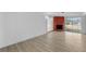 Bright living room features a brick fireplace, wood-look flooring, and plenty of space at 45 S Edgemon Ave, Winter Springs, FL 32708