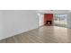 Bright living room features a brick fireplace, wood-look flooring, and plenty of space at 45 S Edgemon Ave, Winter Springs, FL 32708