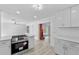 Open concept living room and kitchen with a fireplace, bright and spacious at 45 S Edgemon Ave, Winter Springs, FL 32708